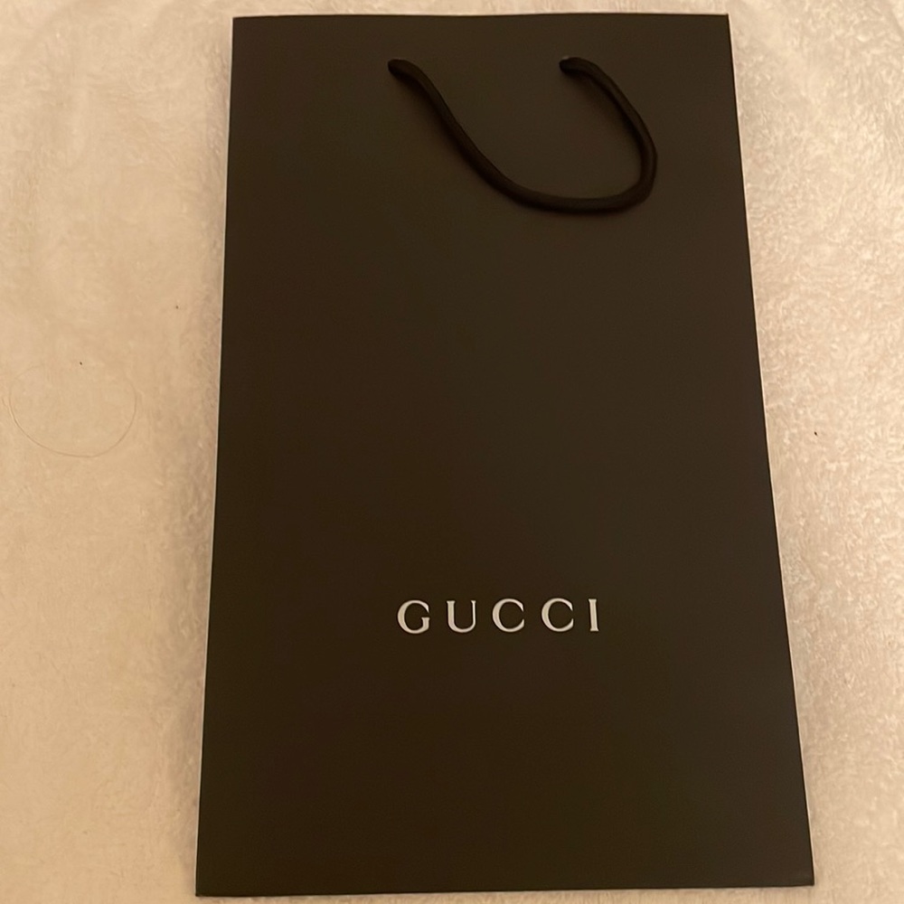 New Authentic Gucci shopping bag approx. 9x15 inches closed. Never used.